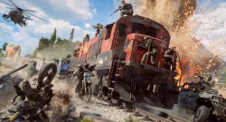 Soldiers battle around a red locomotive on a smoke-filled battlefield with explosions and helicopters overhead.
