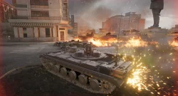 Tank battle in a city street with flames and smoke all around the tanks.