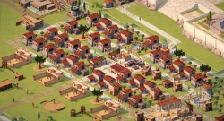 Isometric view of a small town with many white houses and red-tiled roofs, a central plaza, trees, and stone pathways.