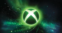 Green glowing Xbox logo with bright white cross, surrounded by swirling neon particles in a dark background