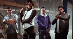 Four adults stand in a warehouse-like setting, arms crossed, posing confidently.