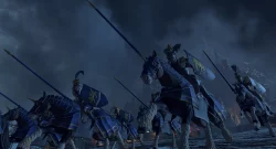 Cavalry of blue-armored knights charging on horseback with long lances through a dark, smoky battlefield.