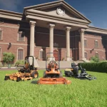 Brick neoclassical building with a clock, tall columns, and steps; several orange lawn mowers sit on the green lawn in front.